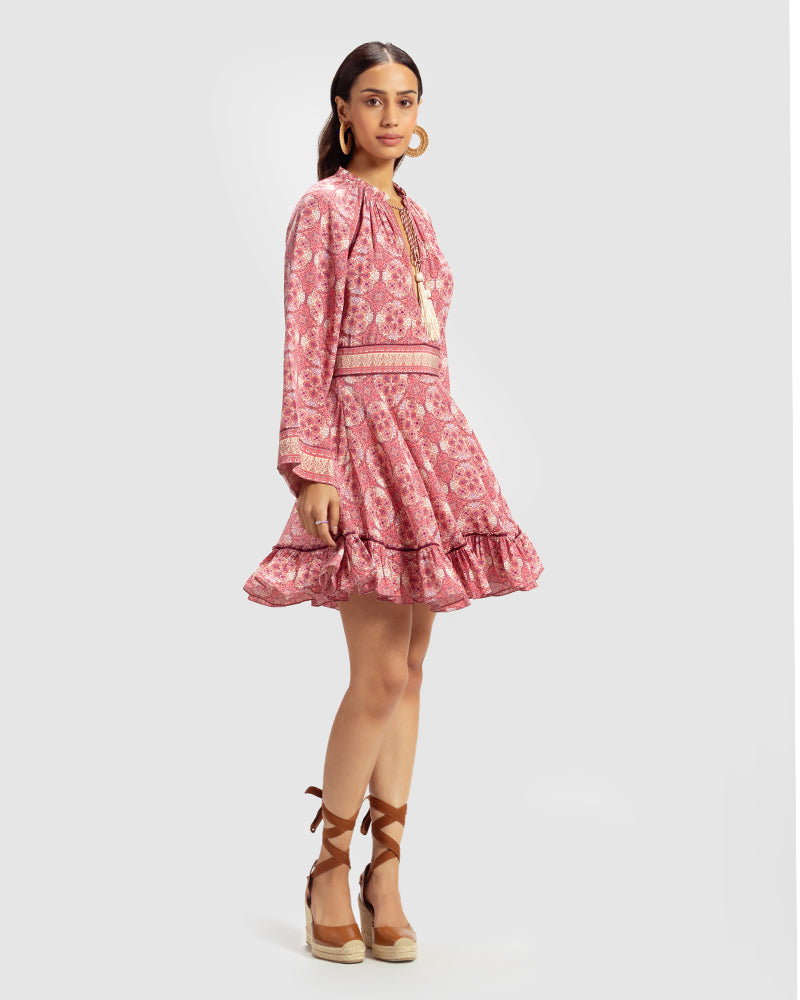 Pink Marissa Print Ruffled Silk DressProduct DescriptionThis print patchwork ruffled dress is a mix of fit and flare, making it a perfect summer dress. It features a V-shaped neckline, a tasselled drawsDressesPink Marissa Print Ruffled Silk Dress