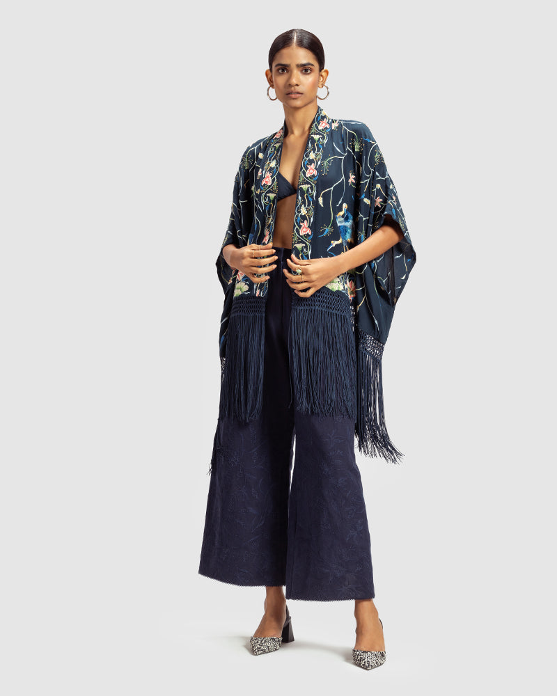 Navy Parsi Gara Embroidered ShrugProduct DescriptionTraditionally seen on Parsi saris, this luxurious silk crepe shrug is adorned with multicoloured Parsi Gara hand embroidery. It also features a geShrugsNavy Parsi Gara Embroidered Shrug