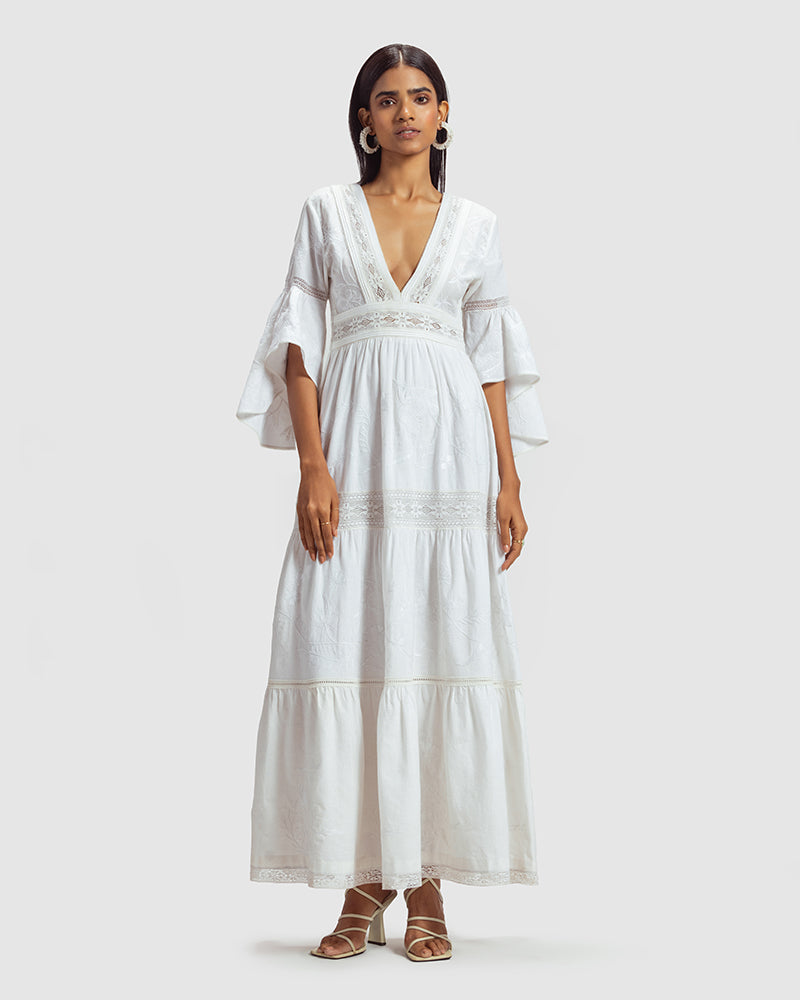 White Lace Trimmed Embroidered Linen Blend Maxi DressProduct DescriptionThis breezy linen blend dress features a mix of lace inserts and white-on-white embroidery inspired by Indian floral and fauna motifs. Also includDressesWhite Lace Trimmed Embroidered Linen Blend Maxi Dress
