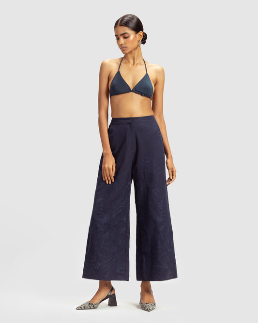 Navy Linen Palazzo Pant With Dori EmbroideryProduct DescriptionOur flared linen palazzo includes Dori embroidery all over and a delicate touch of lace at the hem. It also features a hook-and-eye zipper closurePantsNavy Linen Palazzo Pant