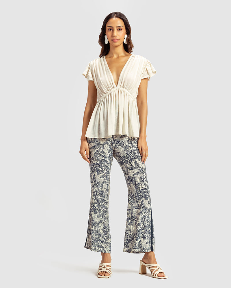 Ivory Gathered Silk Georgette TopProduct DescriptionMade from 100% silk georgette, this top features hand-guided machine embroidery inspired by floral motifs. Details include a V-shaped neckline, smTopsIvory Gathered Silk Georgette Top