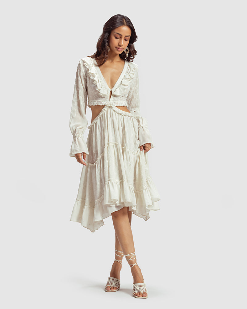 White Embroidered Cutout Silk Georgette DressProduct DescriptionOur silk georgette dress features a prominent cut-out waist, a ruffled neckline, and hand-guided machine embroidery inspired by floral motifs. DetDressesWhite Embroidered Cutout Silk Georgette Dress