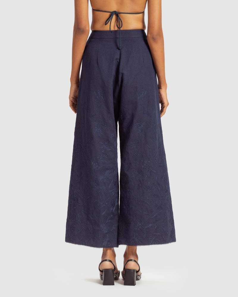 Navy Linen Palazzo Pant With Dori EmbroideryProduct DescriptionOur flared linen palazzo includes Dori embroidery all over and a delicate touch of lace at the hem. It also features a hook-and-eye zipper closurePantsNavy Linen Palazzo Pant