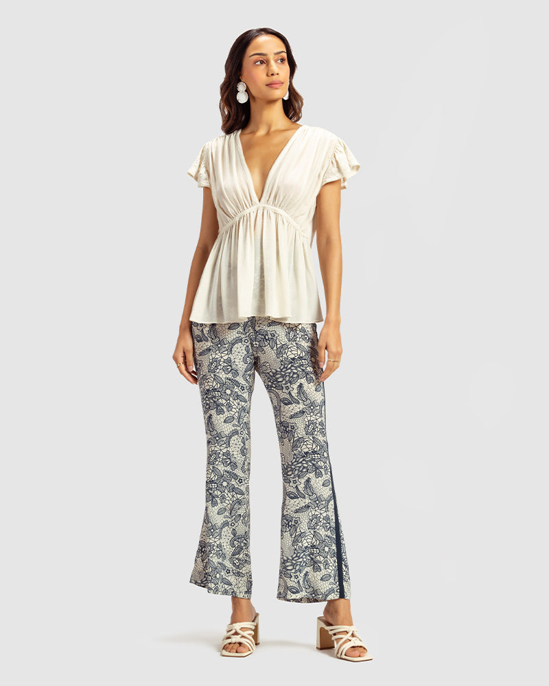 Ivory Gathered Silk Georgette TopProduct DescriptionMade from 100% silk georgette, this top features hand-guided machine embroidery inspired by floral motifs. Details include a V-shaped neckline, smTopsIvory Gathered Silk Georgette Top