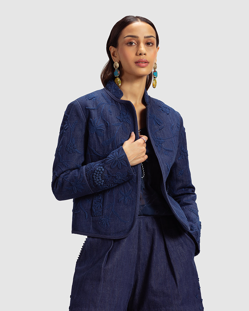 Embellished Handwoven Denim Jacket
Product DescriptionThis fitted, cropped denim jacket is adorned with floral hand embroidery and beading inspired by centuries-old folk miniature paintings. The jackJacketsEmbellished Handwoven Denim Jacket