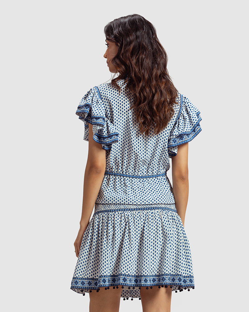 Tara Print Silk Crepe Anaya TopProduct DescriptionThis silk crepe top is enveloped in our contemporary blue print inspired by folk geometric patterns. Details include ruffled sleeves, lace trimminTopsTara Print Silk Crepe Anaya Top