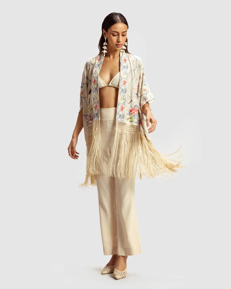 Ivory Parsi Gara Embroidered ShrugProduct DescriptionTraditionally seen on Parsi saris, this luxurious silk crepe shrug is adorned with multicoloured Parsi Gara hand embroidery. It also features a geShrugsIvory Parsi Gara Embroidered Shrug