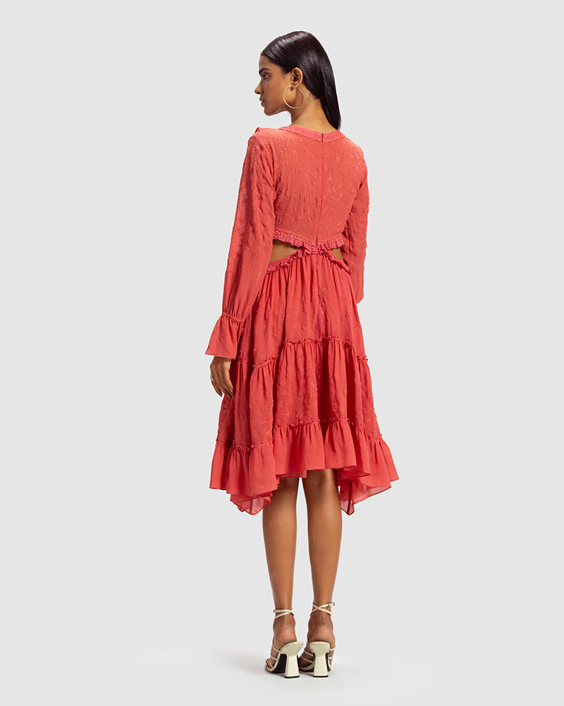 Coral Embroidered Cutout Silk Georgette DressProduct DescriptionOur silk georgette dress features a prominent cut-out waist, a ruffled neckline, and hand-guided machine embroidery inspired by floral motifs. DetDressesCoral Embroidered Cutout Silk Georgette Dress