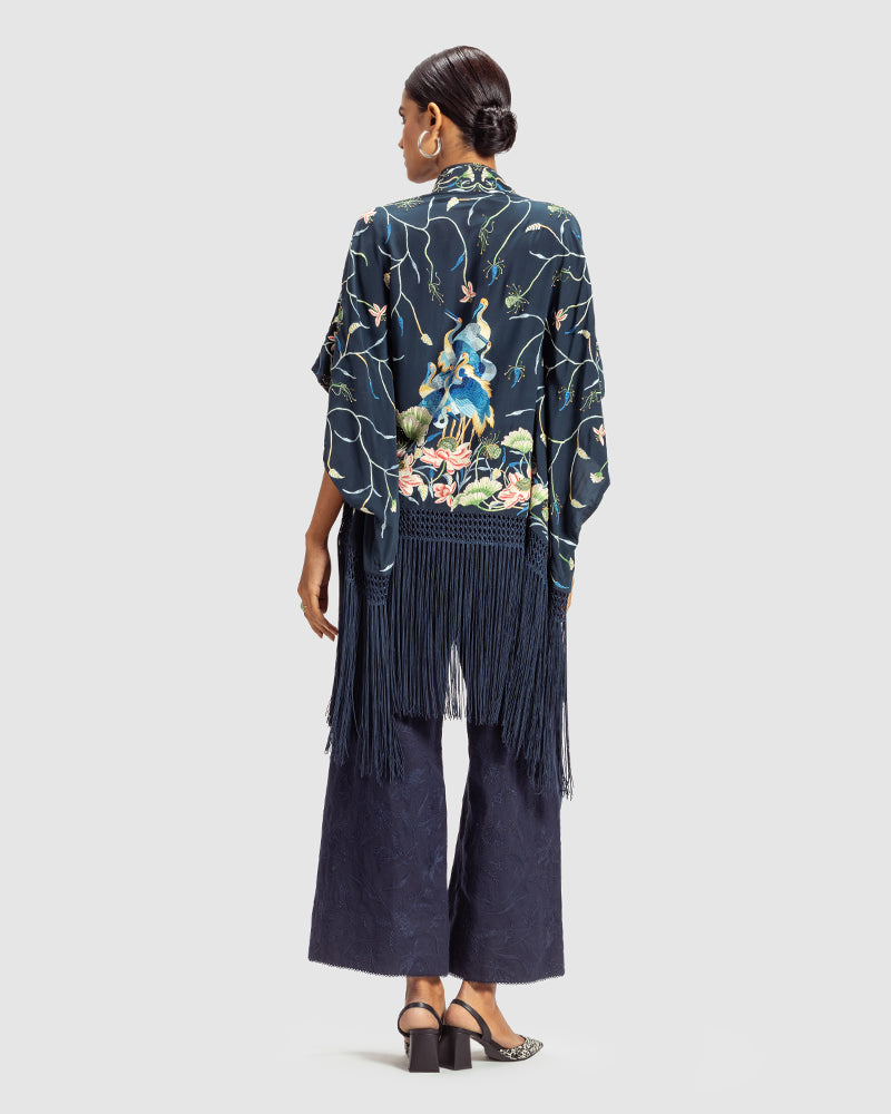 Navy Parsi Gara Embroidered ShrugProduct DescriptionTraditionally seen on Parsi saris, this luxurious silk crepe shrug is adorned with multicoloured Parsi Gara hand embroidery. It also features a geShrugsNavy Parsi Gara Embroidered Shrug