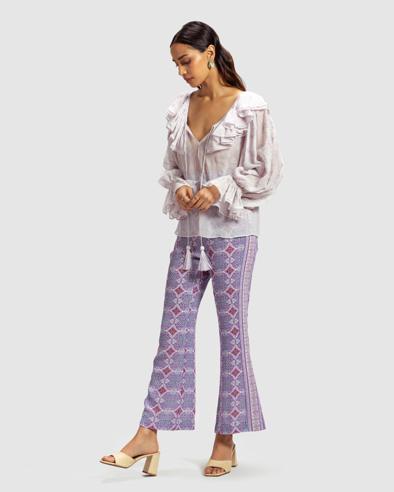 Lilac Ruffled Silk Blouse With Dori EmbroideryProduct DescriptionThis statement crinkled silk chiffon blouse features Dori embroidery and floral motifs inspired by Mughal architecture. Details include elasticateTopsLilac Ruffled Silk Blouse