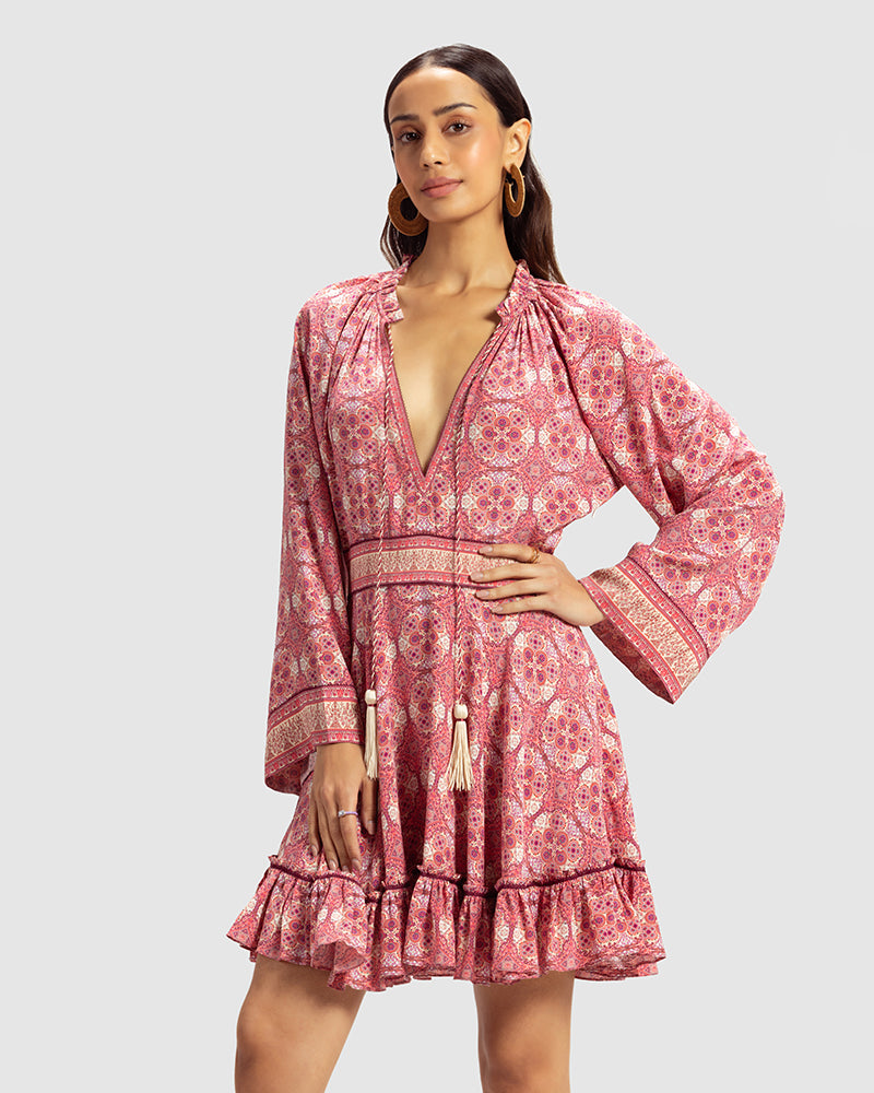 Pink Marissa Print Ruffled Silk DressProduct DescriptionThis print patchwork ruffled dress is a mix of fit and flare, making it a perfect summer dress. It features a V-shaped neckline, a tasselled drawsDressesPink Marissa Print Ruffled Silk Dress
