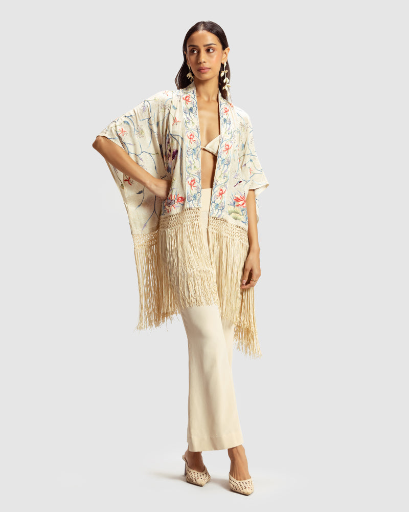 Ivory Parsi Gara Embroidered ShrugProduct DescriptionTraditionally seen on Parsi saris, this luxurious silk crepe shrug is adorned with multicoloured Parsi Gara hand embroidery. It also features a geShrugsIvory Parsi Gara Embroidered Shrug