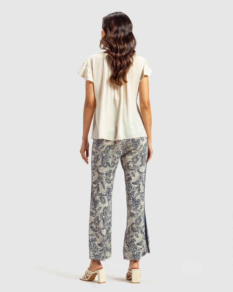 Ivory Gathered Silk Georgette TopProduct DescriptionMade from 100% silk georgette, this top features hand-guided machine embroidery inspired by floral motifs. Details include a V-shaped neckline, smTopsIvory Gathered Silk Georgette Top
