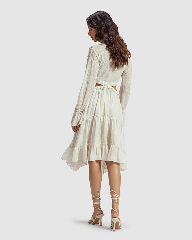 White Embroidered Cutout Silk Georgette DressProduct DescriptionOur silk georgette dress features a prominent cut-out waist, a ruffled neckline, and hand-guided machine embroidery inspired by floral motifs. DetDressesWhite Embroidered Cutout Silk Georgette Dress