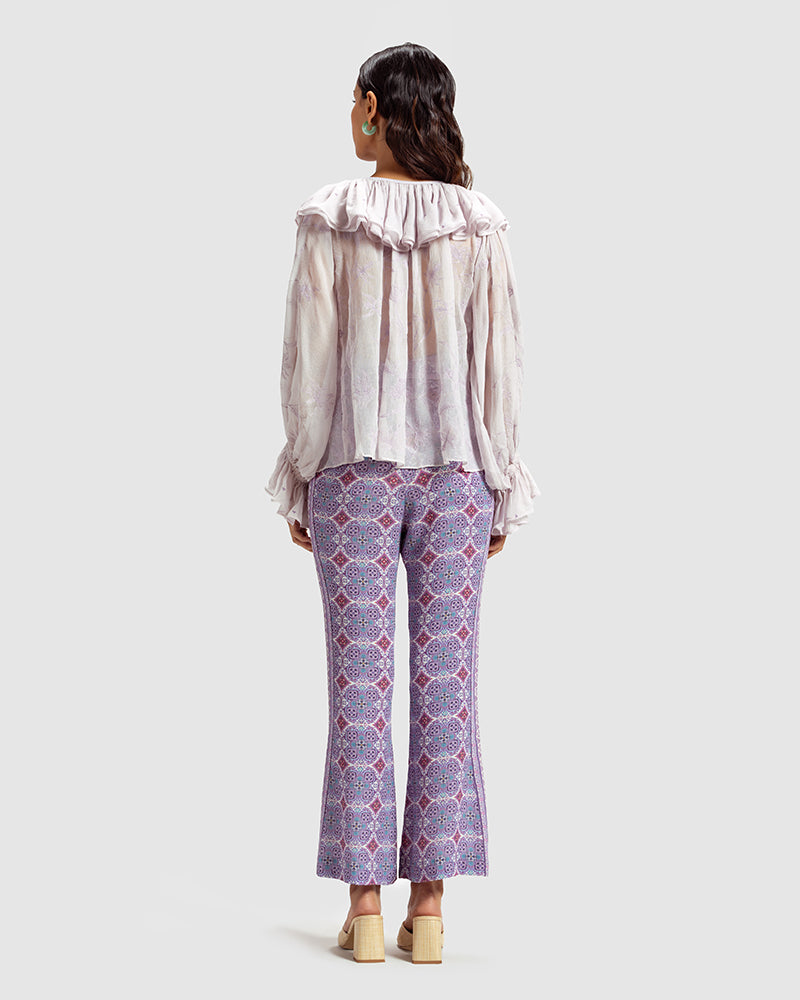 Lilac Ruffled Silk Blouse With Dori EmbroideryProduct DescriptionThis statement crinkled silk chiffon blouse features Dori embroidery and floral motifs inspired by Mughal architecture. Details include elasticateTopsLilac Ruffled Silk Blouse