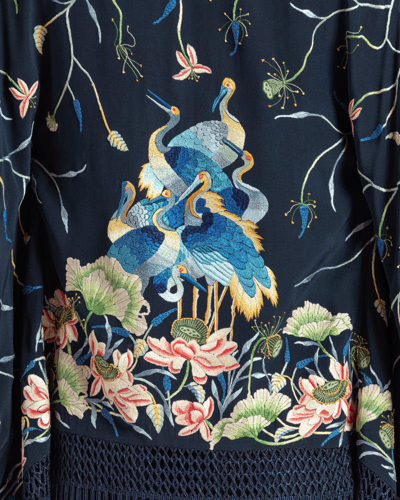Navy Parsi Gara Embroidered ShrugProduct DescriptionTraditionally seen on Parsi saris, this luxurious silk crepe shrug is adorned with multicoloured Parsi Gara hand embroidery. It also features a geShrugsNavy Parsi Gara Embroidered Shrug