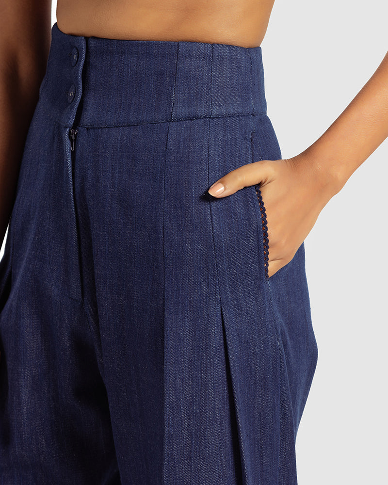Handwoven Pleat Front PantProduct DescriptionThese handwoven denim pants come in a relaxed fit, and feature pleats, a waistband with a two-button closure, a centre-front zipper closure, and sPantsHandwoven Pleat Front Pant