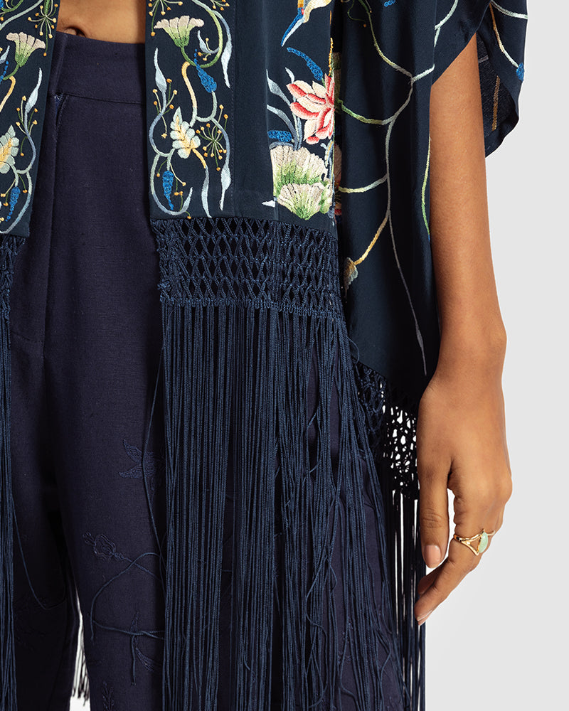 Navy Parsi Gara Embroidered ShrugProduct DescriptionTraditionally seen on Parsi saris, this luxurious silk crepe shrug is adorned with multicoloured Parsi Gara hand embroidery. It also features a geShrugsNavy Parsi Gara Embroidered Shrug