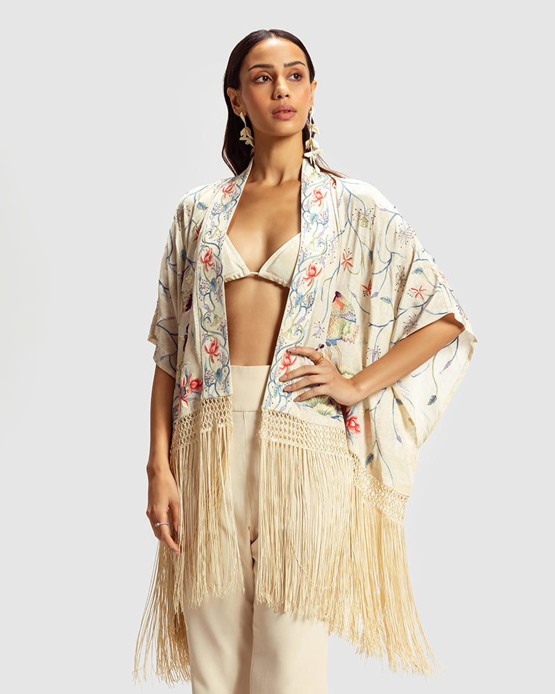 Ivory Parsi Gara Embroidered ShrugProduct DescriptionTraditionally seen on Parsi saris, this luxurious silk crepe shrug is adorned with multicoloured Parsi Gara hand embroidery. It also features a geShrugsIvory Parsi Gara Embroidered Shrug