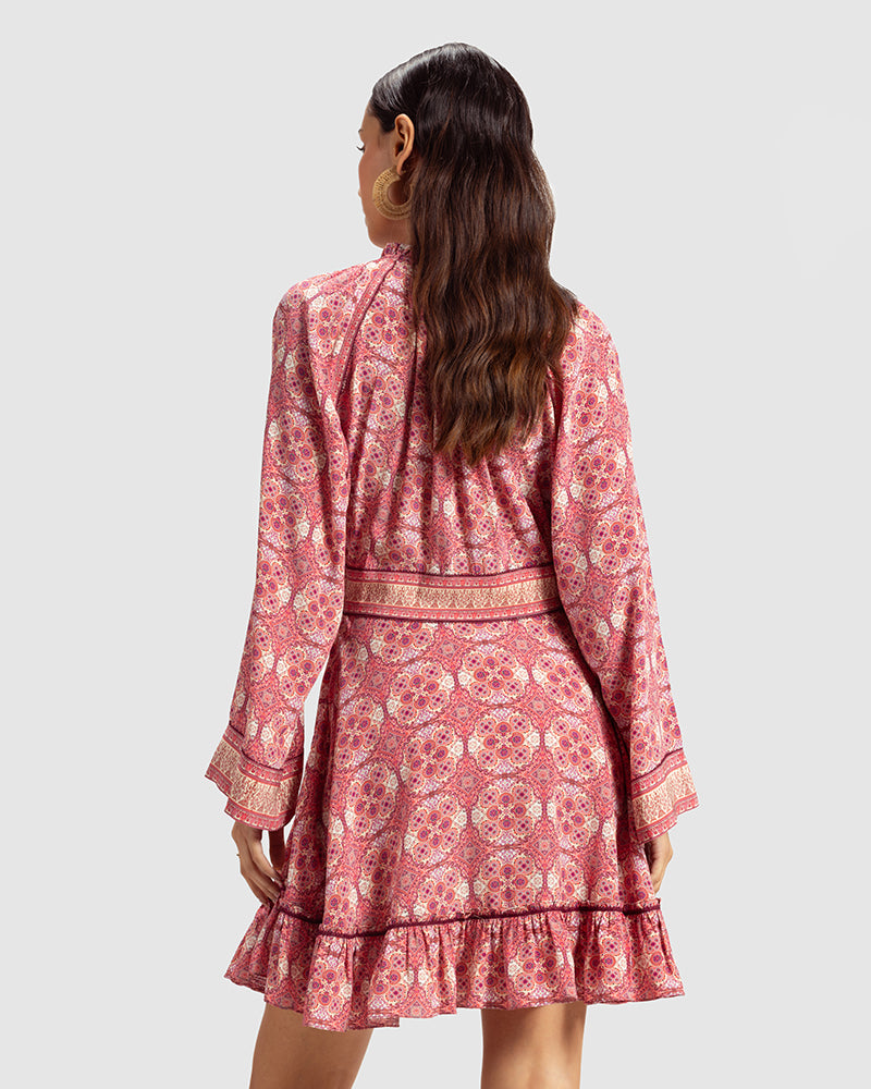 Pink Marissa Print Ruffled Silk DressProduct DescriptionThis print patchwork ruffled dress is a mix of fit and flare, making it a perfect summer dress. It features a V-shaped neckline, a tasselled drawsDressesPink Marissa Print Ruffled Silk Dress