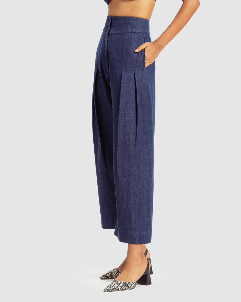 Handwoven Pleat Front PantProduct DescriptionThese handwoven denim pants come in a relaxed fit, and feature pleats, a waistband with a two-button closure, a centre-front zipper closure, and sPantsHandwoven Pleat Front Pant