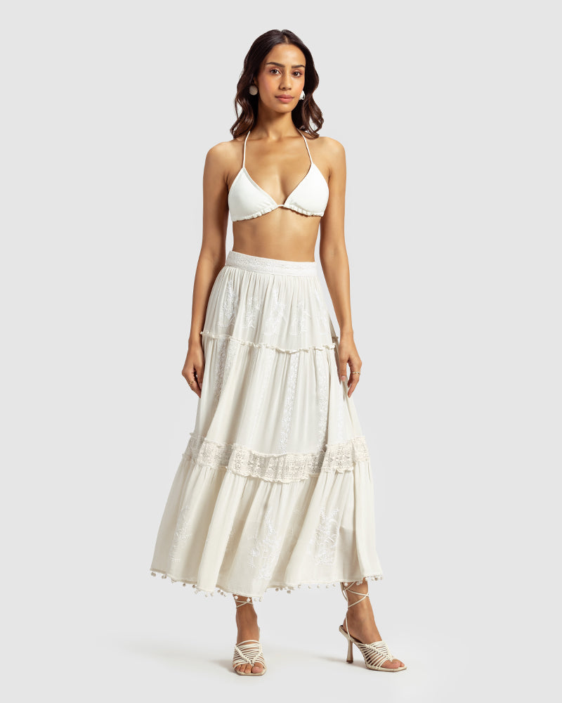 Chikankari Tiered SkirtProduct DescriptionOur tiered skirt features intricate hand chikankari embroidery with delicate jaali work and embossed white-thread stitching. The garment also inclSkirtsChikankari Tiered Skirt