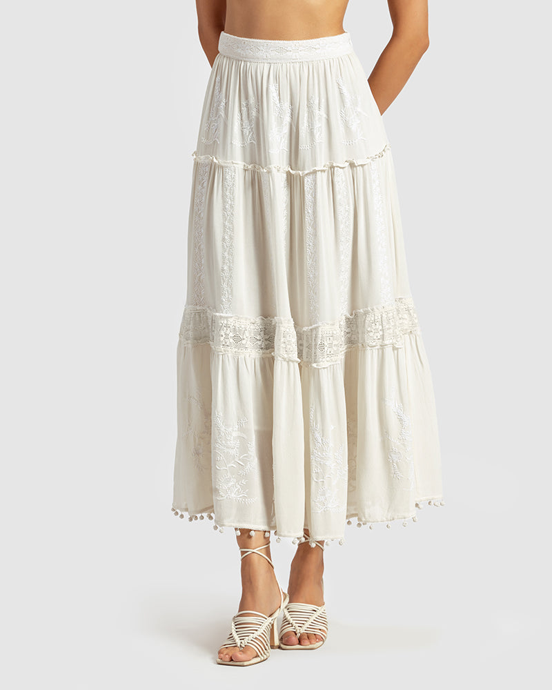 Chikankari Tiered SkirtProduct DescriptionOur tiered skirt features intricate hand chikankari embroidery with delicate jaali work and embossed white-thread stitching. The garment also inclSkirtsChikankari Tiered Skirt