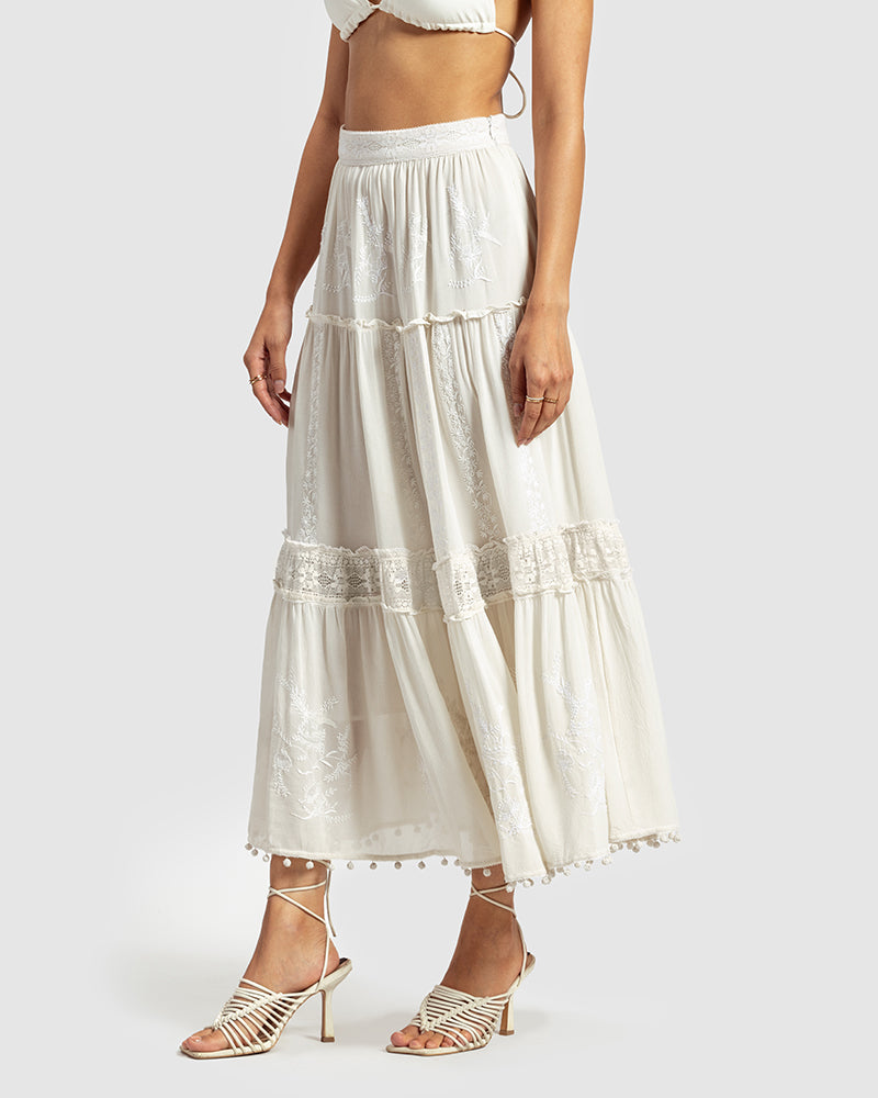 Chikankari Tiered SkirtProduct DescriptionOur tiered skirt features intricate hand chikankari embroidery with delicate jaali work and embossed white-thread stitching. The garment also inclSkirtsChikankari Tiered Skirt