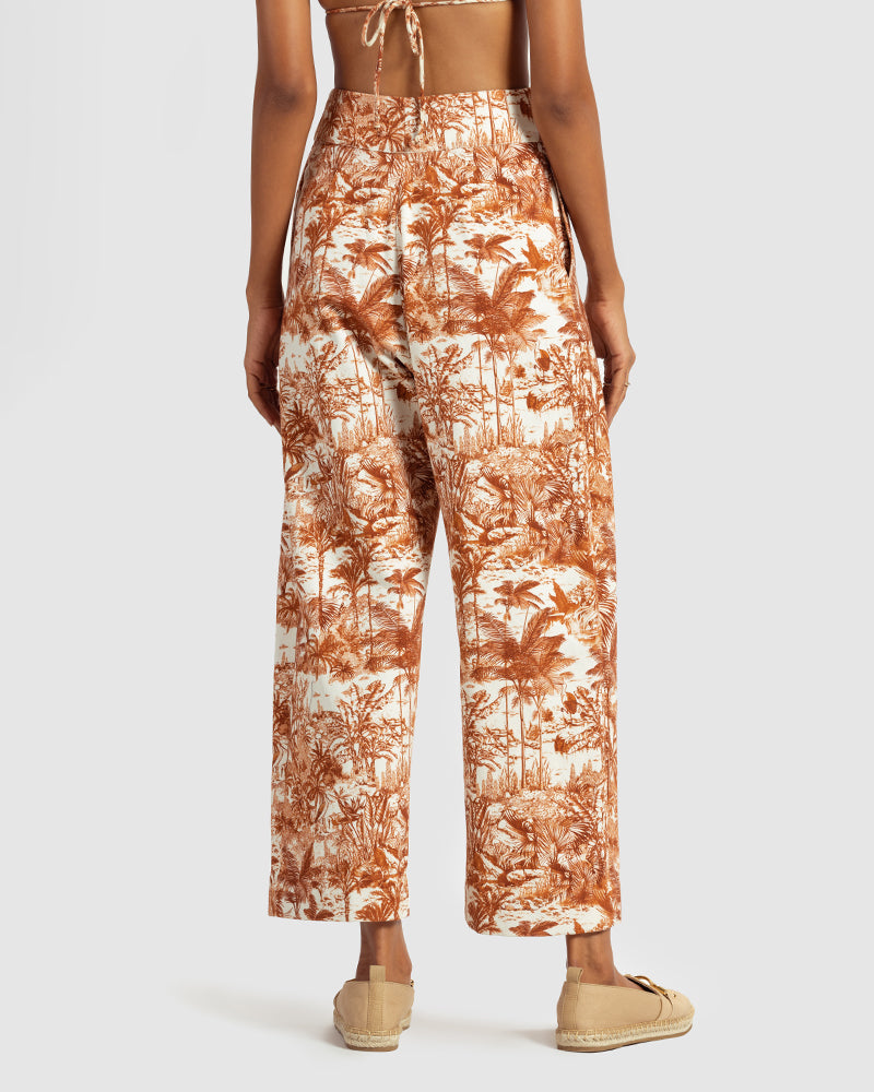 Brown Tropical Print Cotton Twill PantProduct DescriptionMade from cotton twill, these high-waisted pleated pants feature our statement tropical print that reimagines Indian flora and fauna motifs with cPantsBrown Tropical Print Cotton Twill Pant