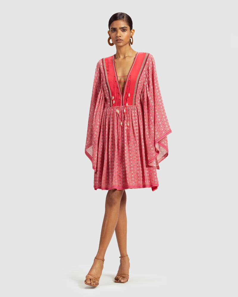 Coral Geo Print Gathered Silk DressProduct DescriptionWith print patchwork inspired by folk geometric patterns, this gathered dress is how we’ve reimagined Talitha’s signature bohemian language. Made DressesCoral Geo Print Gathered Silk Dress