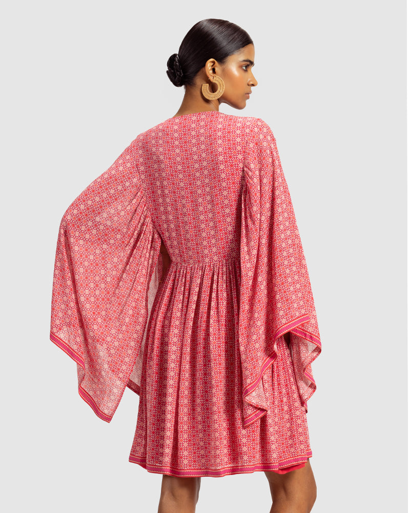Coral Geo Print Gathered Silk DressProduct DescriptionWith print patchwork inspired by folk geometric patterns, this gathered dress is how we’ve reimagined Talitha’s signature bohemian language. Made DressesCoral Geo Print Gathered Silk Dress