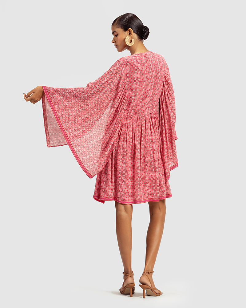 Coral Geo Print Gathered Silk DressProduct DescriptionWith print patchwork inspired by folk geometric patterns, this gathered dress is how we’ve reimagined Talitha’s signature bohemian language. Made DressesCoral Geo Print Gathered Silk Dress