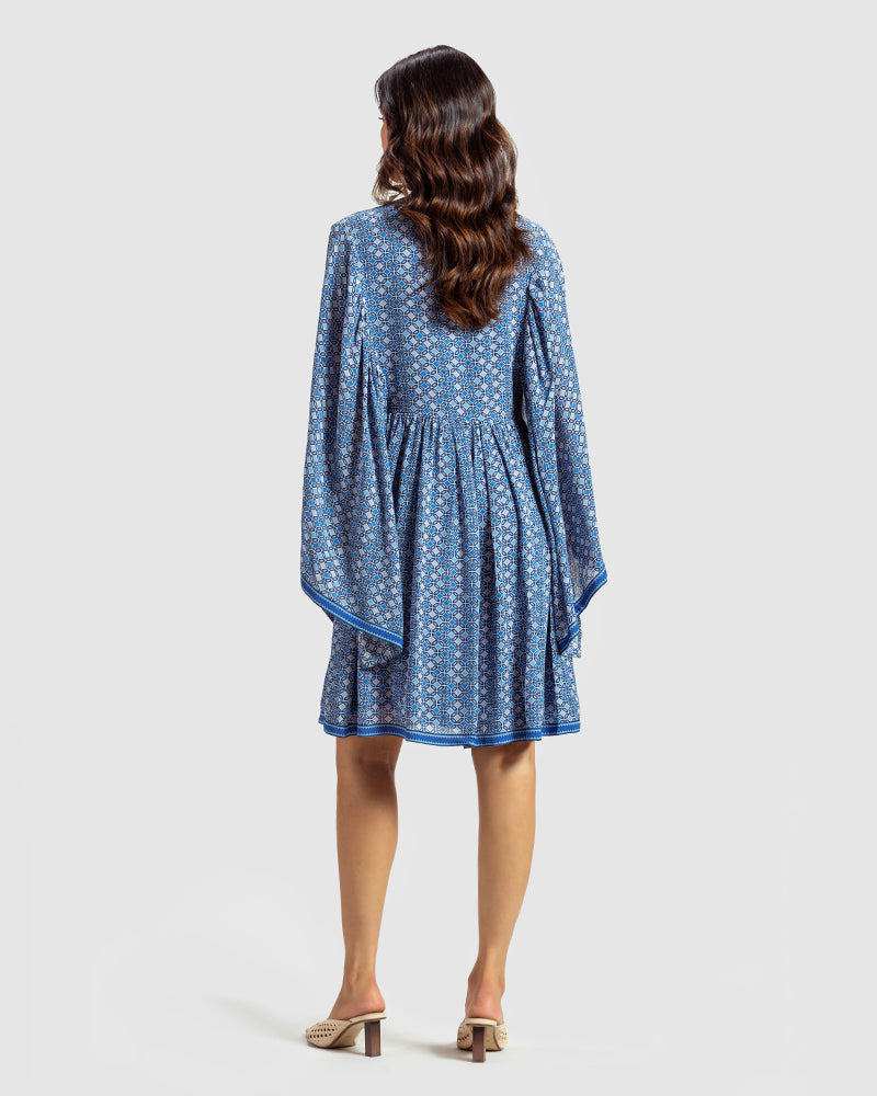 Blue Geo Print Gathered Silk DressProduct DescriptionWith print patchwork inspired by folk geometric patterns, this gathered dress is how we’ve reimagined Talitha’s signature bohemian language. Made DressesBlue Geo Print Gathered Silk Dress