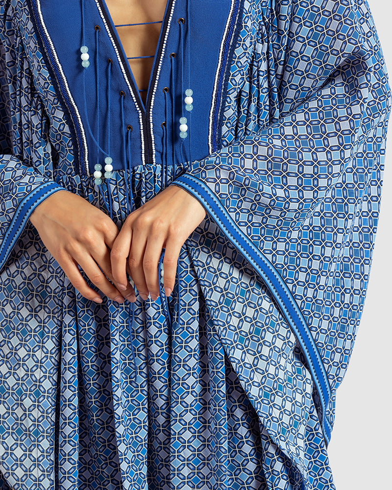 Blue Geo Print Gathered Silk DressProduct DescriptionWith print patchwork inspired by folk geometric patterns, this gathered dress is how we’ve reimagined Talitha’s signature bohemian language. Made DressesBlue Geo Print Gathered Silk Dress