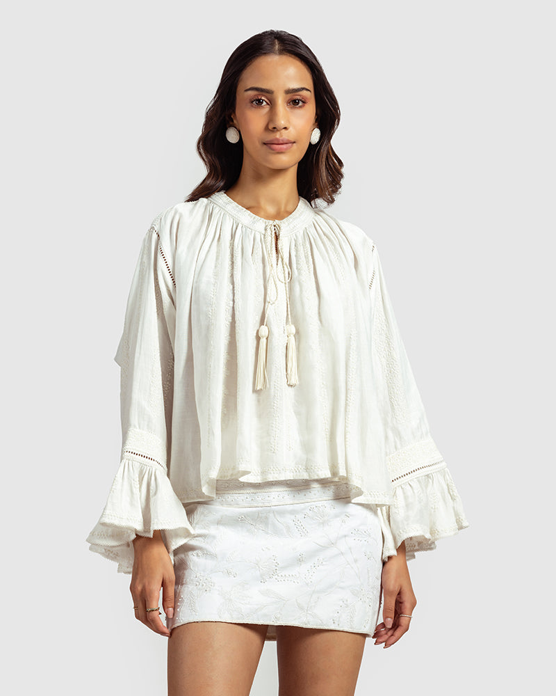 White Embroidered Linen Blend Boho TopProduct DescriptionThis linen blend boho top features an eclectic blend of white-on-white lace and embroidery with Kolam-inspired motifs. Comes in an oversized relaxTopsWhite Embroidered Linen Blend Boho Top