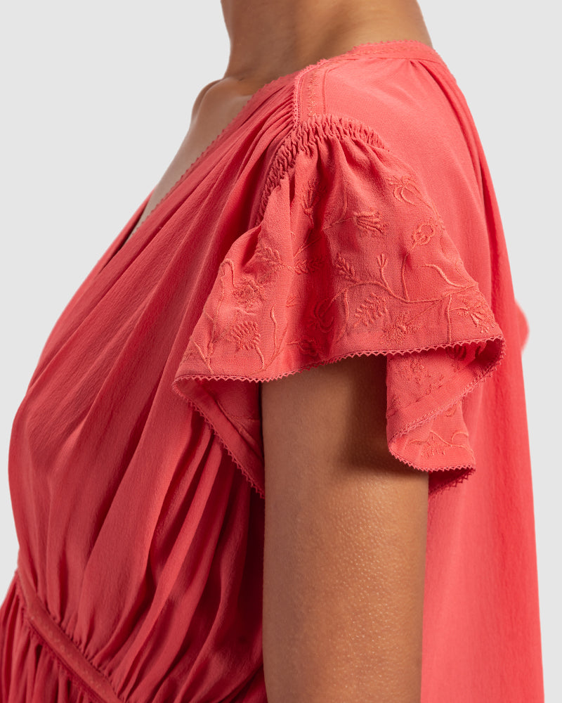 Coral Gathered Silk Georgette TopProduct DescriptionMade from 100% silk georgette, this top features hand-guided machine embroidery inspired by floral motifs. Details include a V-shaped neckline, smTopsCoral Gathered Silk Georgette Top