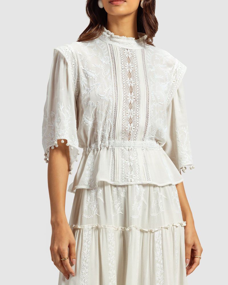 Chikankari Lace Trimmed TopProduct DescriptionMade in collaboration with Sangraha Atelier, this silk georgette top is enveloped in luxe hand chikankari embroidery. The garment also features piTopsChikankari Lace Trimmed Top