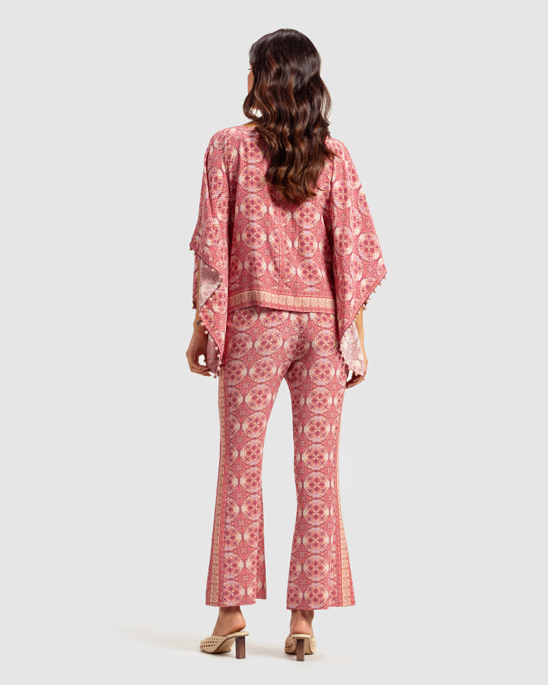 Pink Marissa Print Silk Poncho TopProduct DescriptionMade from silk crepe, this boatneck poncho top features our modern geometric print patchwork. Comes in a relaxed fit and also features bobble trimTopsPink Marissa Print Silk Poncho Top