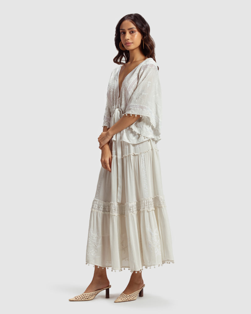 Chikankari Silk Georgette TopProduct DescriptionCreated in collaboration with Sangraha Atelier, this statement silk georgette top features delicate hand chikankari embroidery. Details include a TopsChikankari Silk Georgette Top