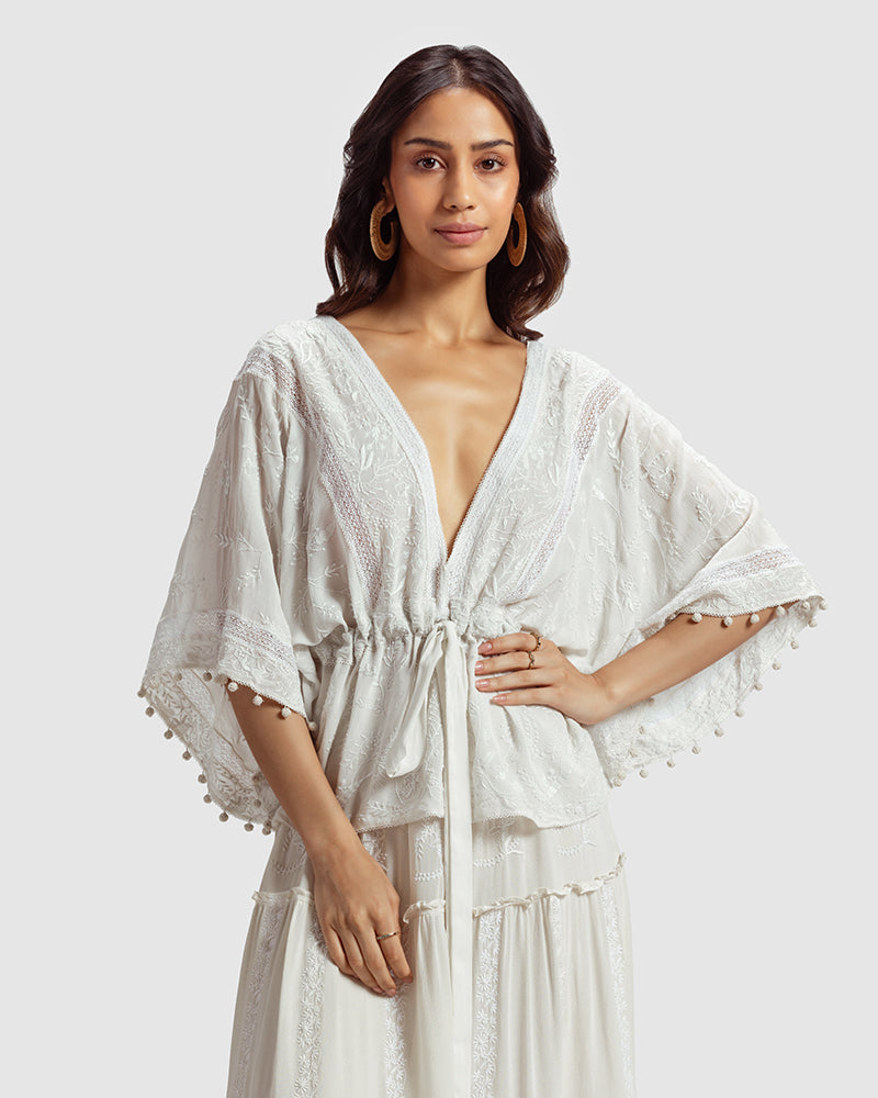 Chikankari Silk Georgette TopProduct DescriptionCreated in collaboration with Sangraha Atelier, this statement silk georgette top features delicate hand chikankari embroidery. Details include a TopsChikankari Silk Georgette Top