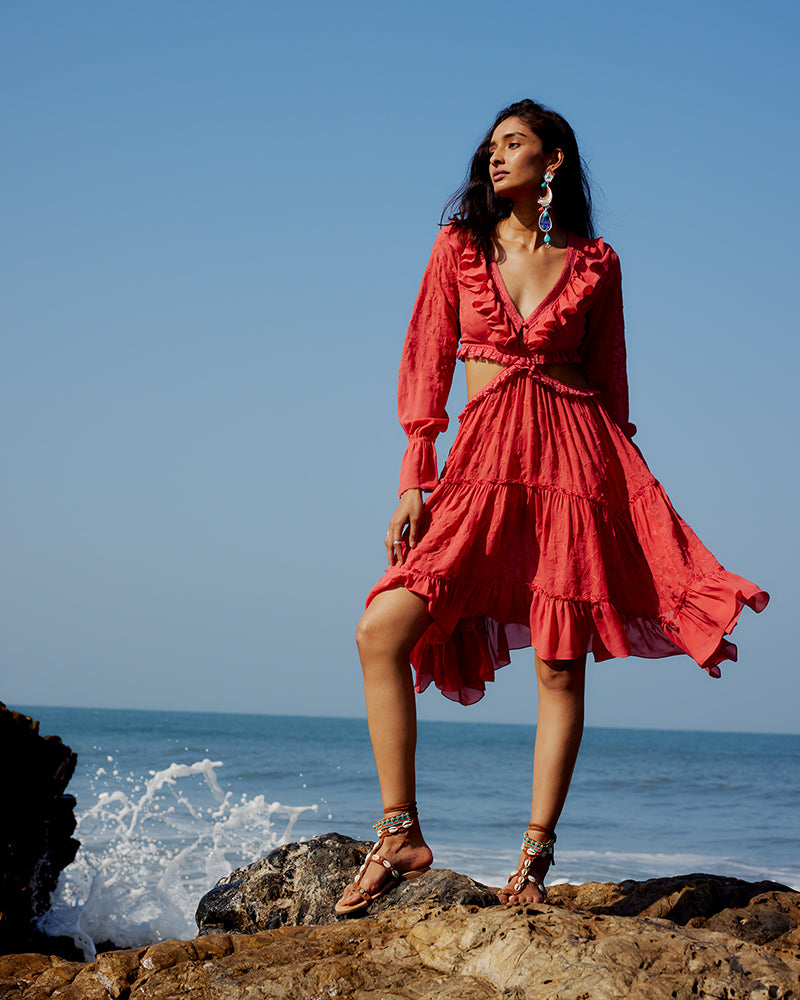 Coral Embroidered Cutout Silk Georgette DressProduct DescriptionOur silk georgette dress features a prominent cut-out waist, a ruffled neckline, and hand-guided machine embroidery inspired by floral motifs. DetDressesCoral Embroidered Cutout Silk Georgette Dress