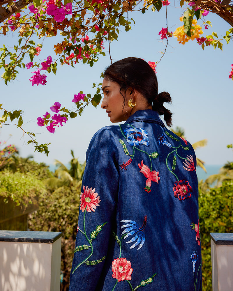 Fiori Embroidered Handwoven Denim JacketProduct DescriptionThis handwoven denim jacket is adorned with exquisite floral motifs inspired by centuries-old folk miniature paintings and crafted using hand needJacketsFiori Embroidered Handwoven Denim Jacket