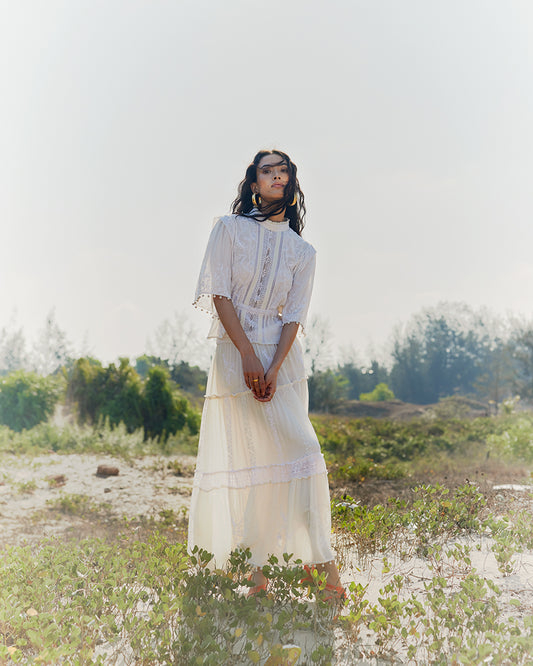 Chikankari Lace Trimmed TopProduct DescriptionMade in collaboration with Sangraha Atelier, this silk georgette top is enveloped in luxe hand chikankari embroidery. The garment also features piTopsChikankari Lace Trimmed Top