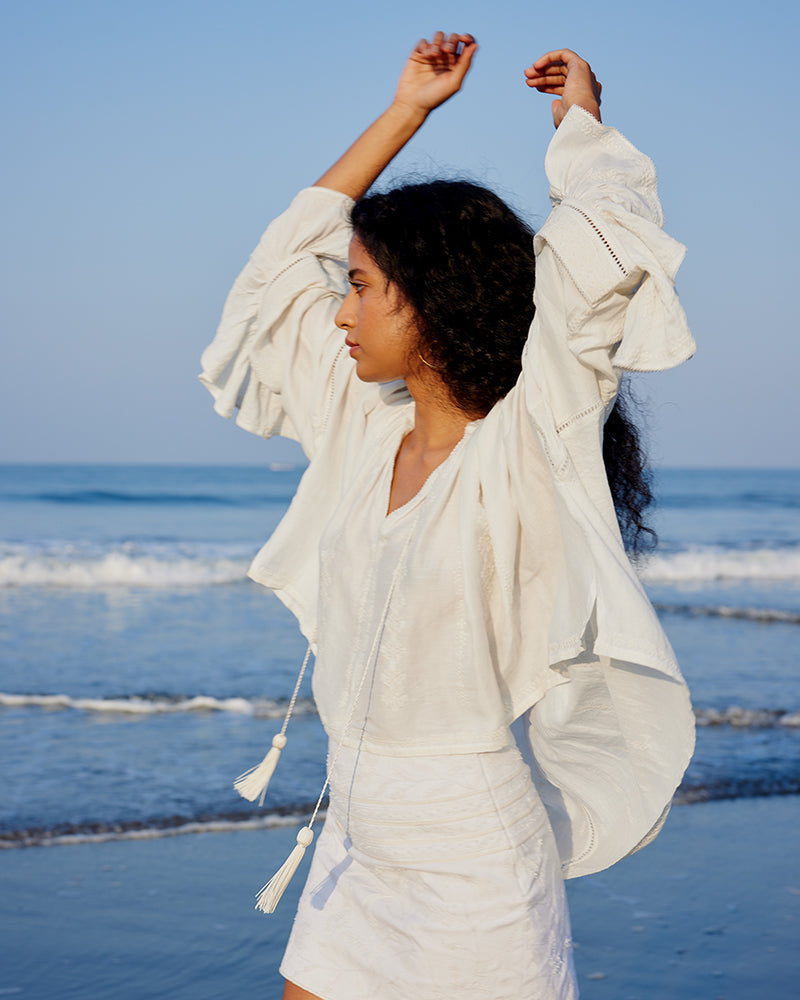White Embroidered Linen Blend Boho TopProduct DescriptionThis linen blend boho top features an eclectic blend of white-on-white lace and embroidery with Kolam-inspired motifs. Comes in an oversized relaxTopsWhite Embroidered Linen Blend Boho Top