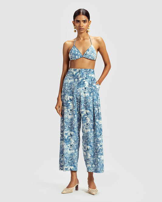 Blue Tropical Print Silk Pleated PantProduct DescriptionMade from silk satin, these high-waisted pleated pants feature our statement tropical print that reimagines Indian flora and fauna motifs with conPantsBlue Tropical Print Silk Pleated Pant