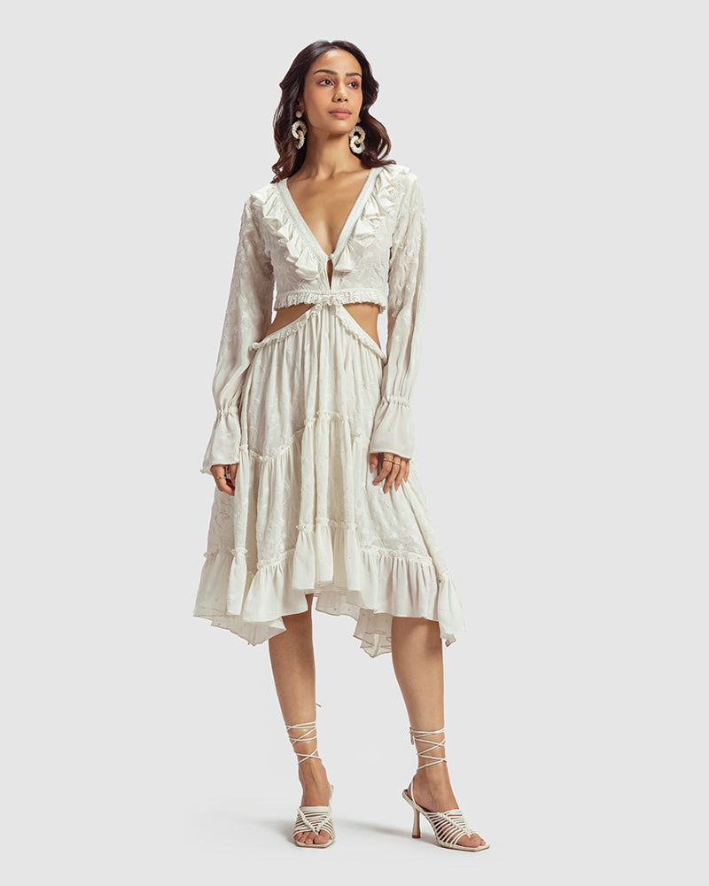 White Embroidered Cutout Silk Georgette DressProduct DescriptionOur silk georgette dress features a prominent cut-out waist, a ruffled neckline, and hand-guided machine embroidery inspired by floral motifs. DetDressesWhite Embroidered Cutout Silk Georgette Dress
