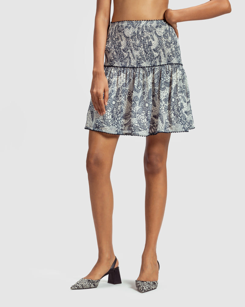 Lace Print Silk Georgette Minka SkirtProduct DescriptionEmbodying a sense of feminine charm, this silk georgette skirt is enveloped in our French lace-inspired print. Also includes smocking on the frontSkirtsLace Print Silk Georgette Minka Skirt