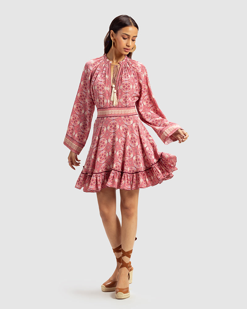 Pink Marissa Print Ruffled Silk DressProduct DescriptionThis print patchwork ruffled dress is a mix of fit and flare, making it a perfect summer dress. It features a V-shaped neckline, a tasselled drawsDressesPink Marissa Print Ruffled Silk Dress