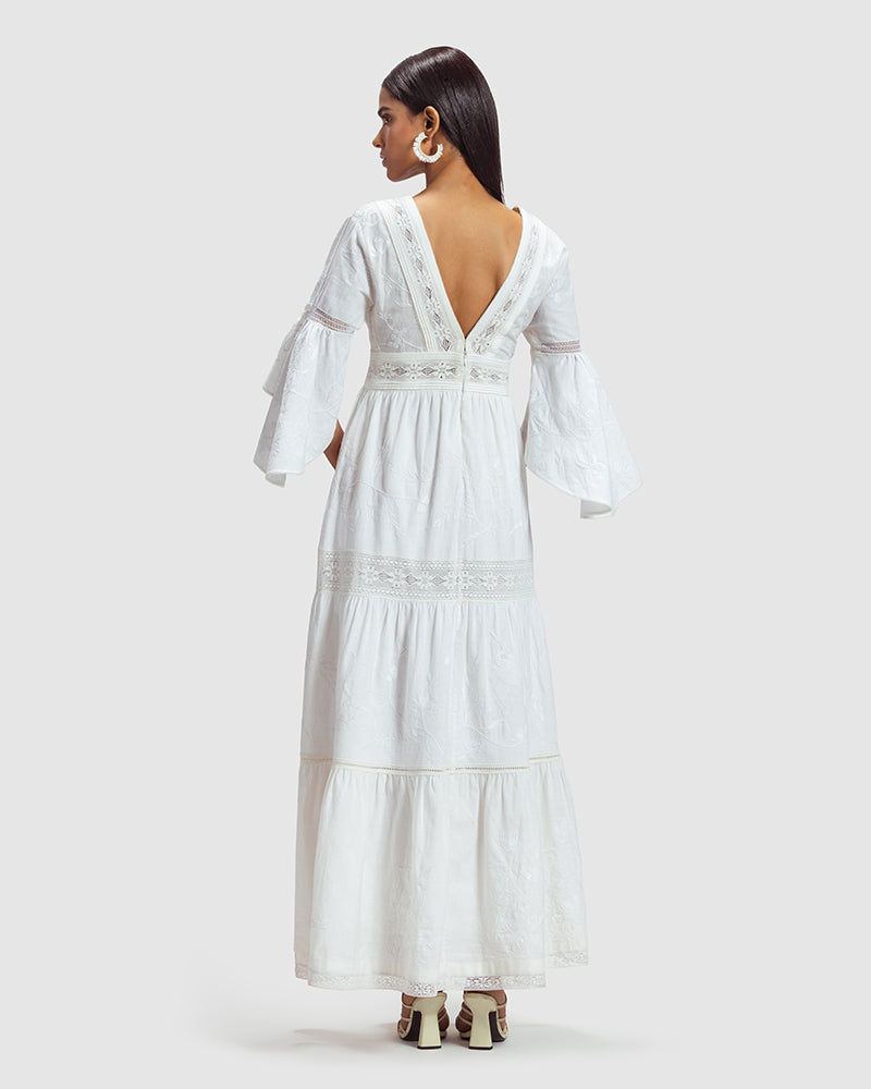 White Lace Trimmed Embroidered Linen Blend Maxi DressProduct DescriptionThis breezy linen blend dress features a mix of lace inserts and white-on-white embroidery inspired by Indian floral and fauna motifs. Also includDressesWhite Lace Trimmed Embroidered Linen Blend Maxi Dress