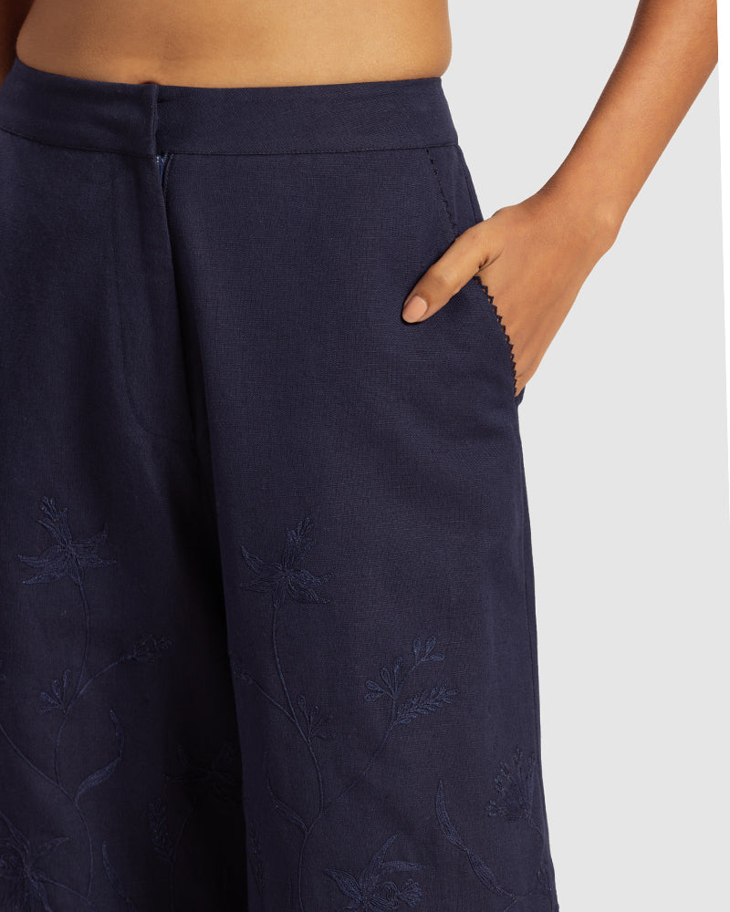 Navy Linen Palazzo Pant With Dori EmbroideryProduct DescriptionOur flared linen palazzo includes Dori embroidery all over and a delicate touch of lace at the hem. It also features a hook-and-eye zipper closurePantsNavy Linen Palazzo Pant